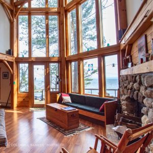 Staged Adirondack home interior with fireplace.